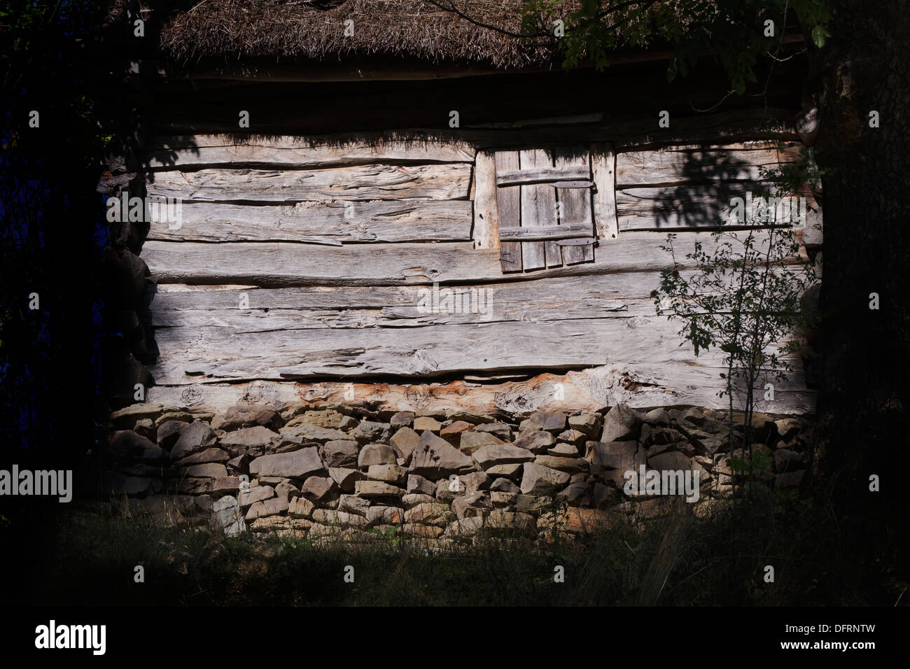 old wooden house with window closed Stock Photo - Alamy