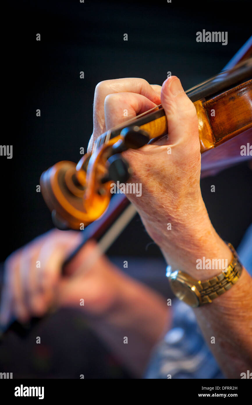 Closeup of elderly man playing a violin Stock Photo