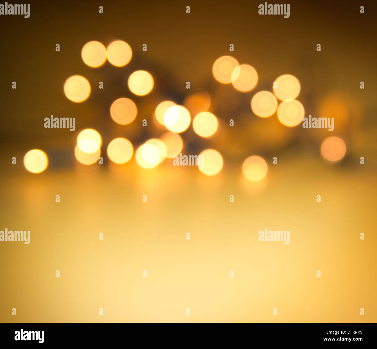 blurred, glowing lights on golden background Stock Photo