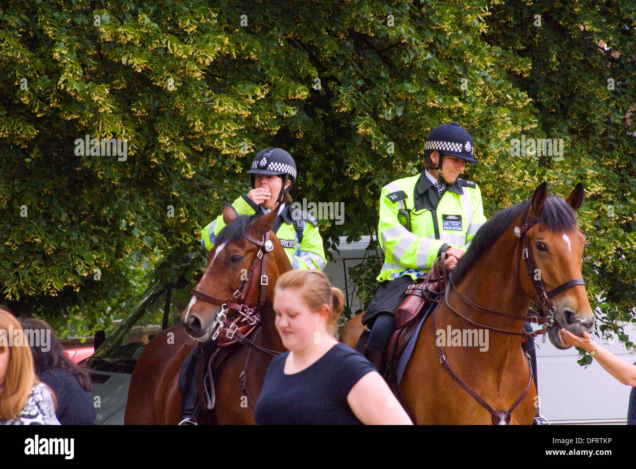 funfair Wimbledon Common ,London UK,police officers on patrol on horseback Stock Photo