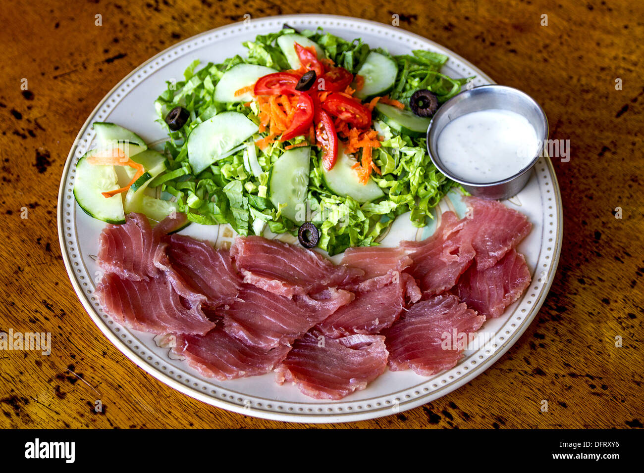 Yellowfin tuna sashimi, fresh raw fish served with a green salad Stock