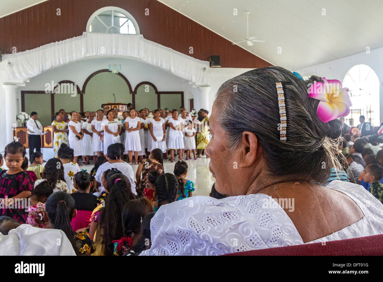 Micronesian women dressed in white lace sing four part choral harmony during church service in Tafunsak, Kosrae, Micronesia Stock Photo
