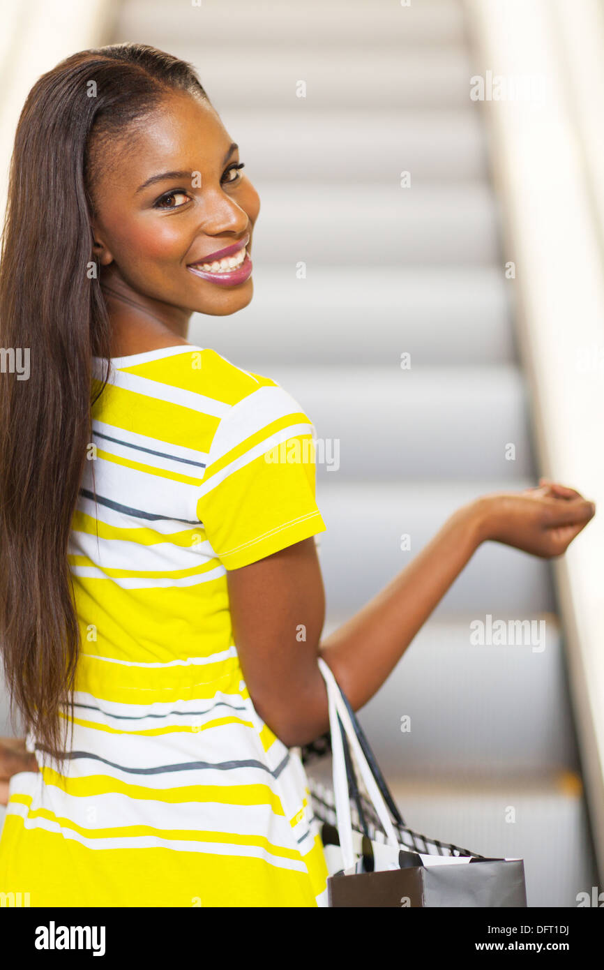 beautiful African woman going shopping in mall Stock Photo