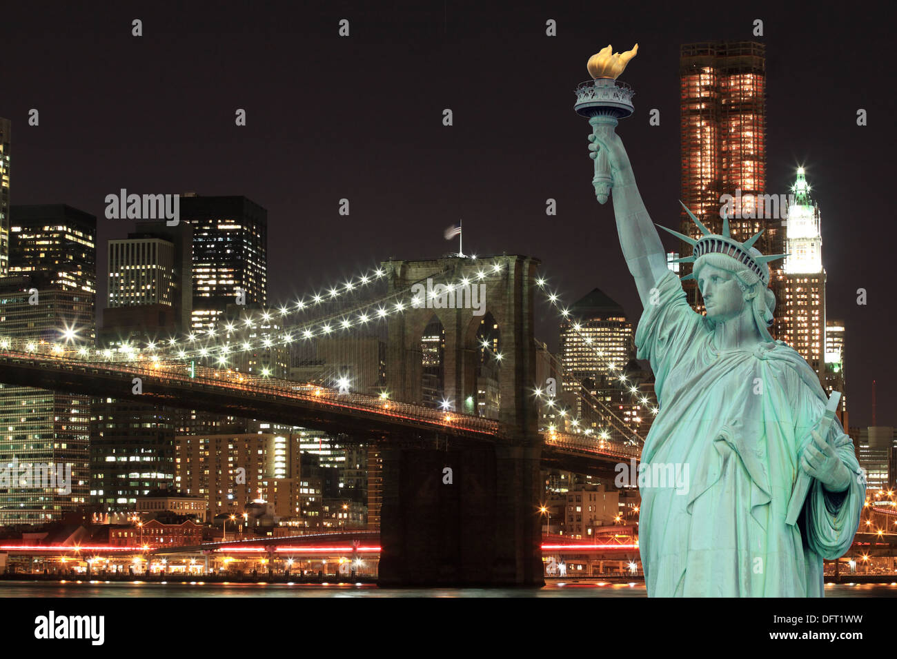 Brooklyn Bridge and The Statue of Liberty at Night, New York City Stock