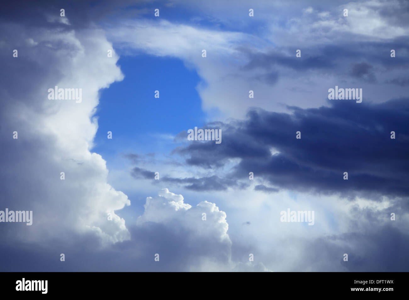 Deep blue sky background with storm clouds. Cloudy sky full of gray