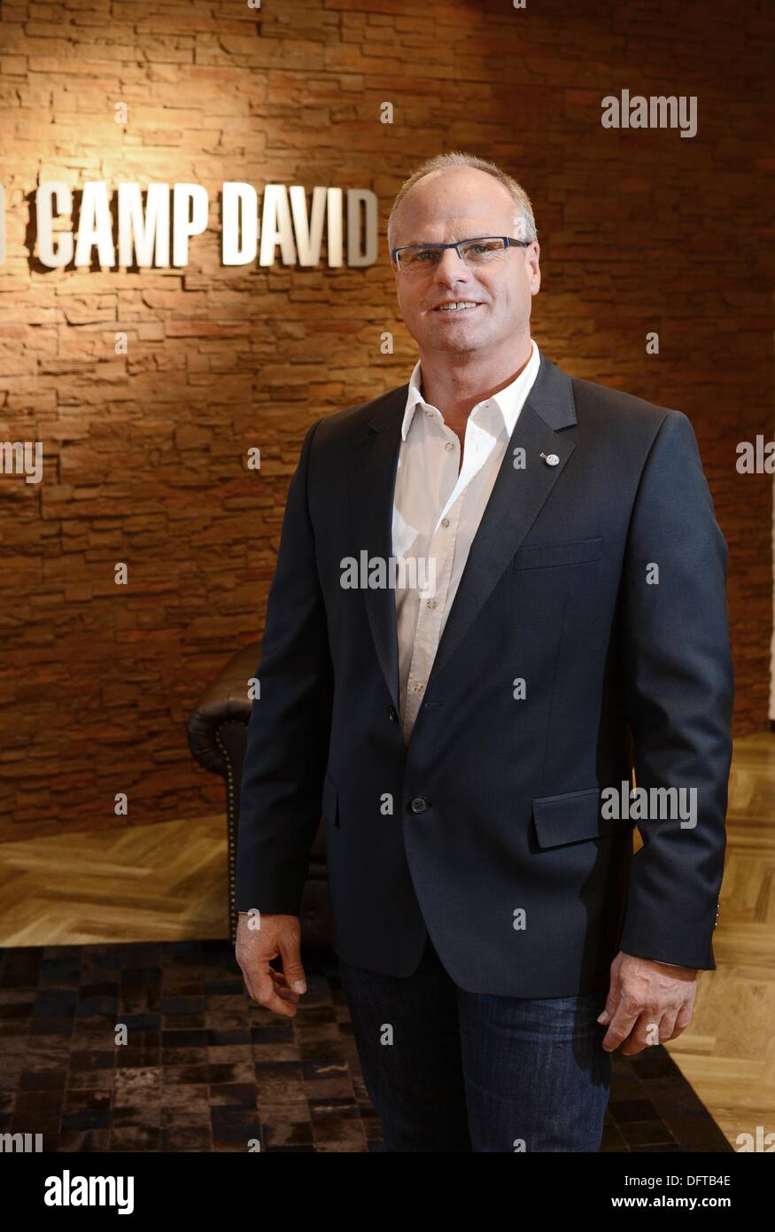 Hoppegarten, Germany. 13th Sep, 2013. dpa-exclusive - Thomas Finkbeiner,  manager of the Clinton Grosshandels GmbH (with labels including Camp David  and Soccx) is photographed at company headquarters in Hoppegarten, Germany,  13 September