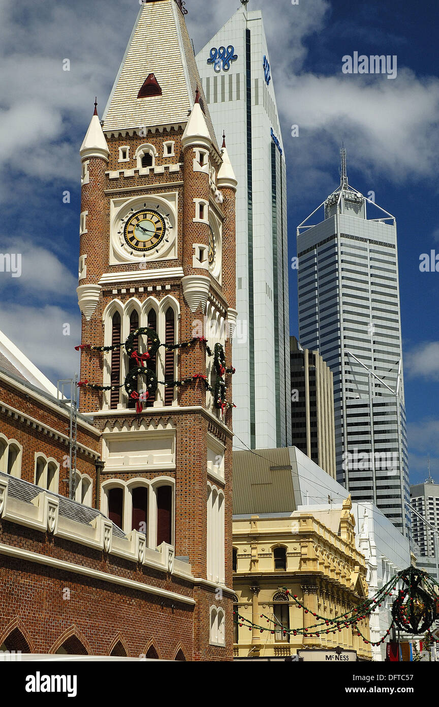 Clock tower of the Perth Town Hall juxtaposed against modern buildings