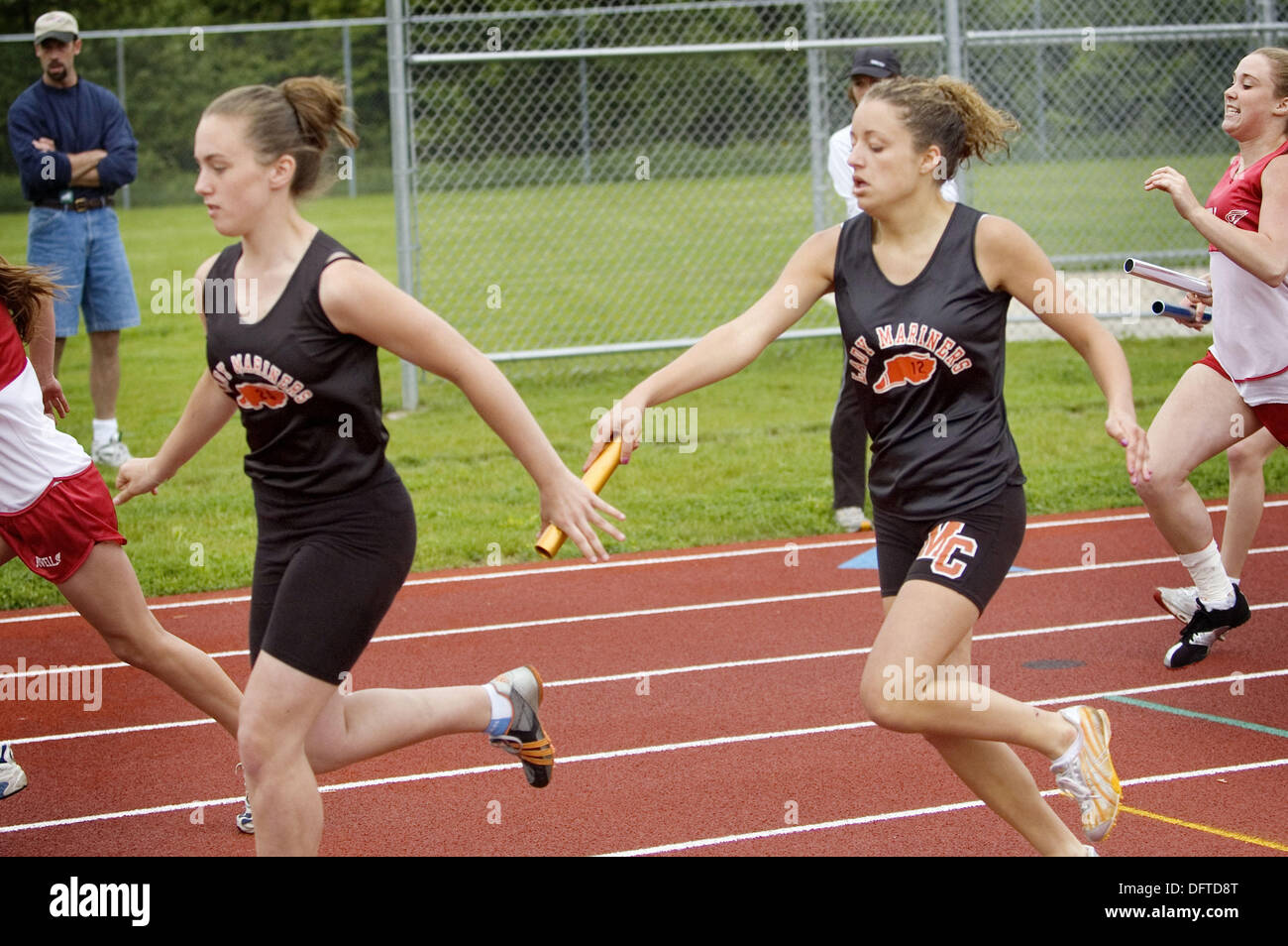 Middle school ages teens participate in track and field events Stock