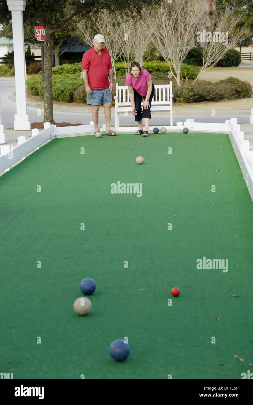 playing miniature lawn bowling at The Villages is a retirement community  near Orlando and Ocala Florida developed for active Stock Photo - Alamy