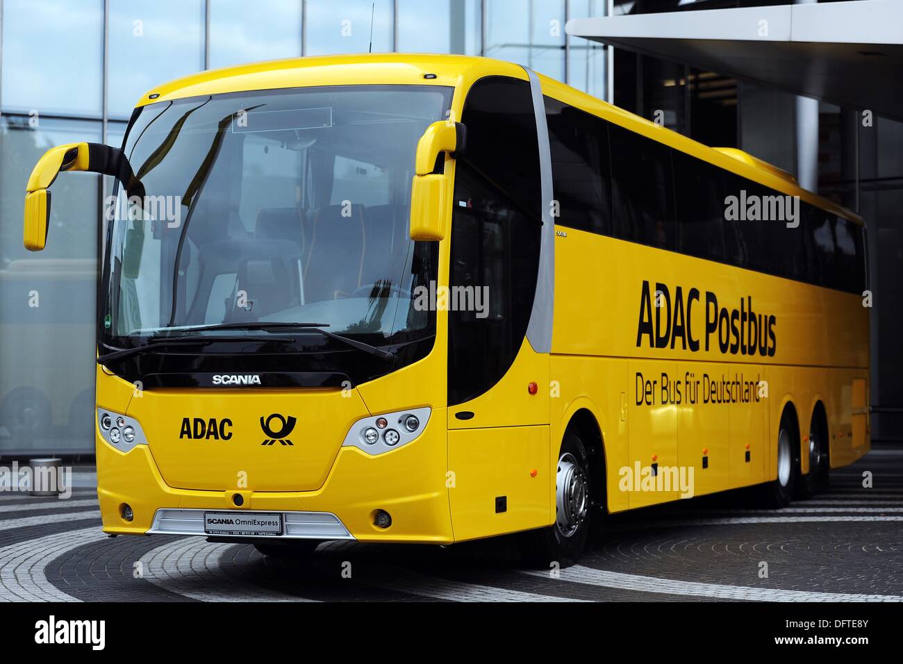 Bonn, Germany. 09th Oct, 2013. An ADAC Postbus is parked outside of  Deutsche Post headquarters in Bonn, Germany, 09 October 2013. The  automobile club ADAC and the Deutsche Post are unveiling their