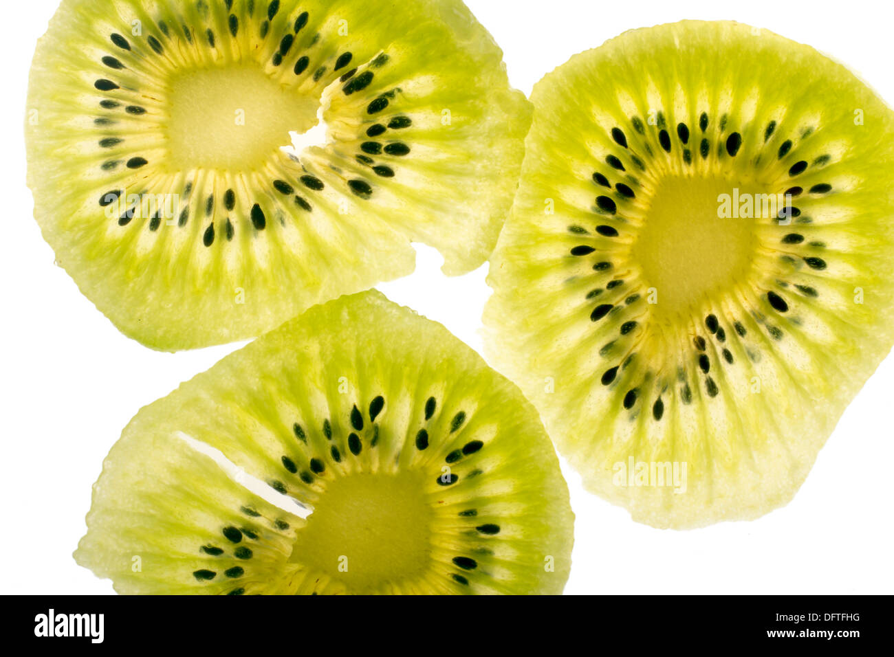 Slices of kiwi fruit, isolated on white. Stock Photo