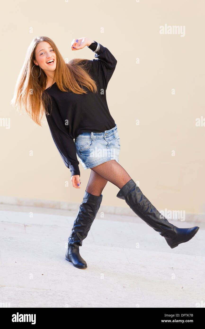 Playful young woman on the street Stock Photo - Alamy