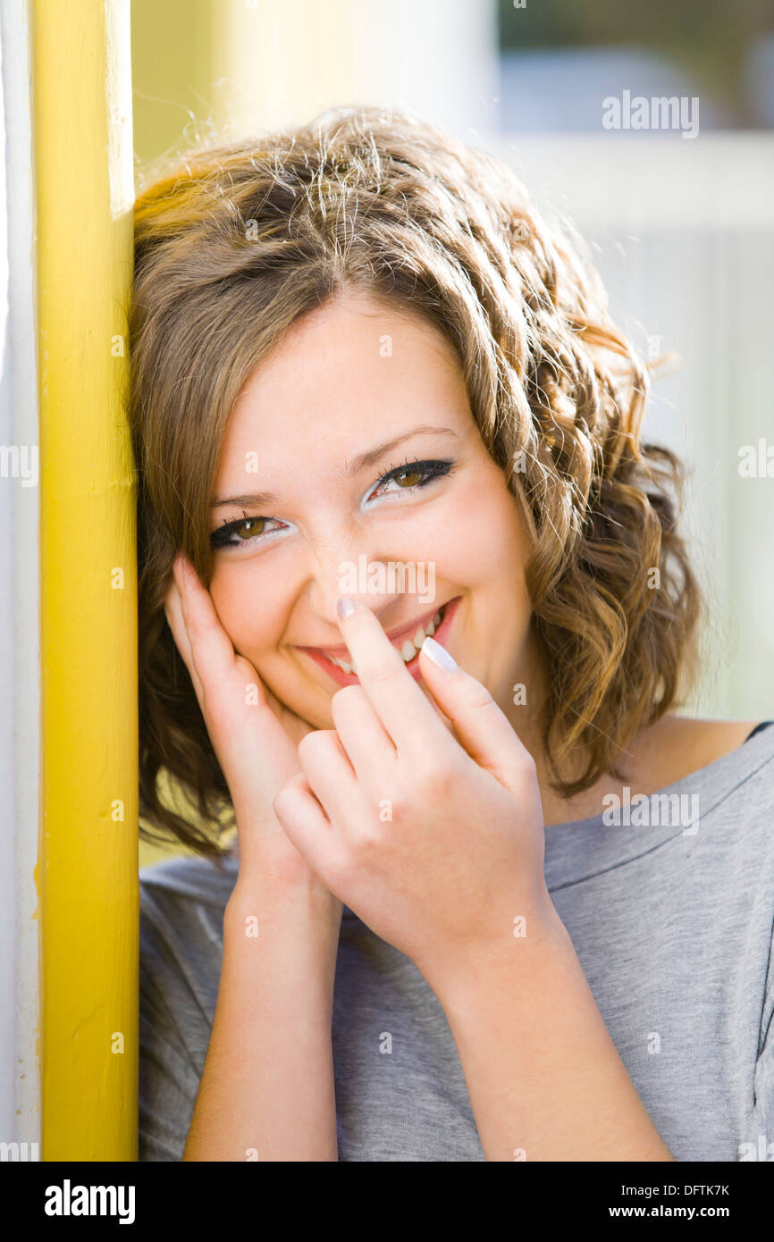 Happy young woman portrait touching nose with a finger Stock Photo Alamy
