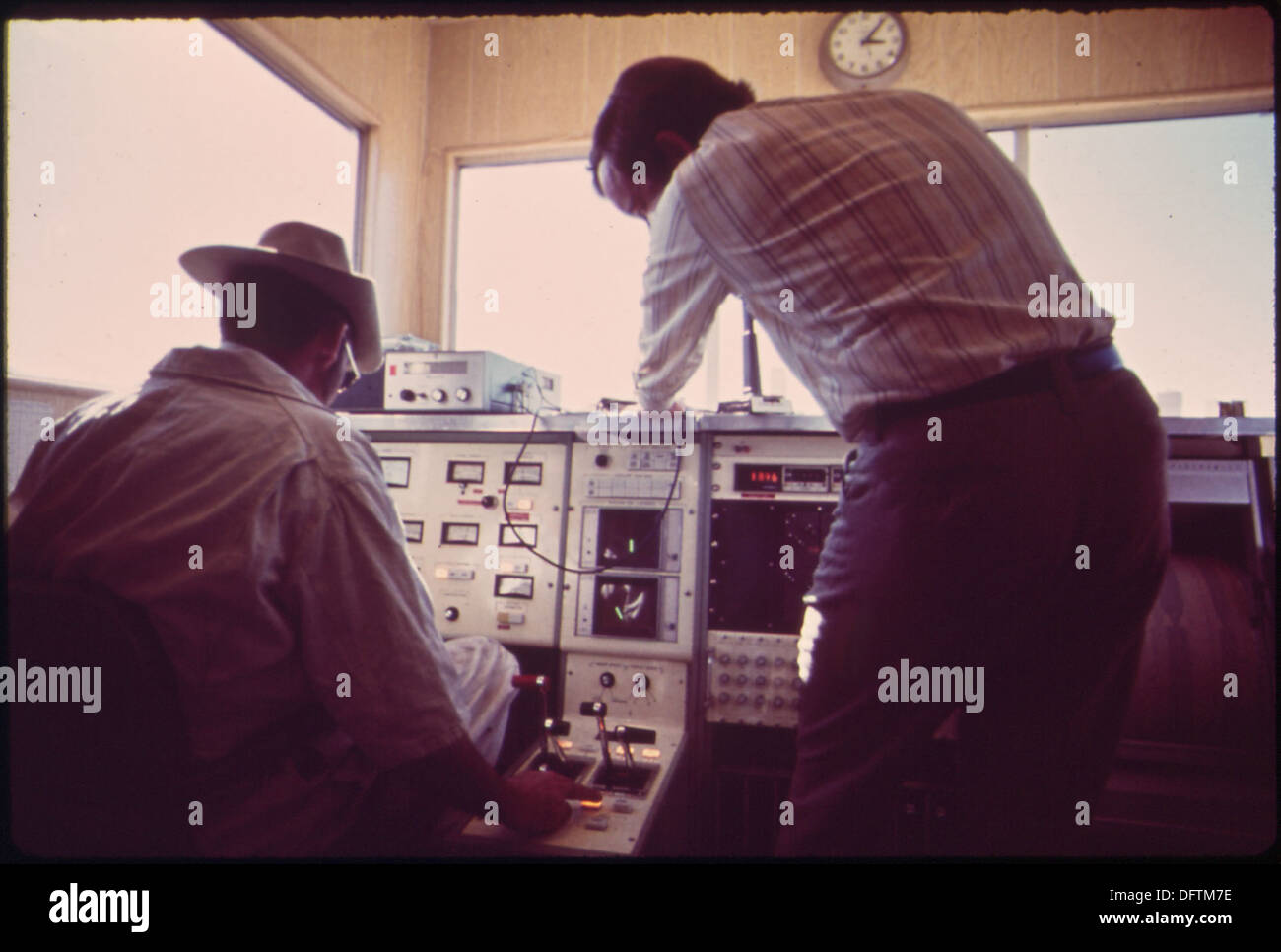 Technicians are seen working at the data control center for the Linear Induction Motor Test Vehicle (LIMTV), a project focused on transportation innovation and advanced engineering technology. Stock Photo