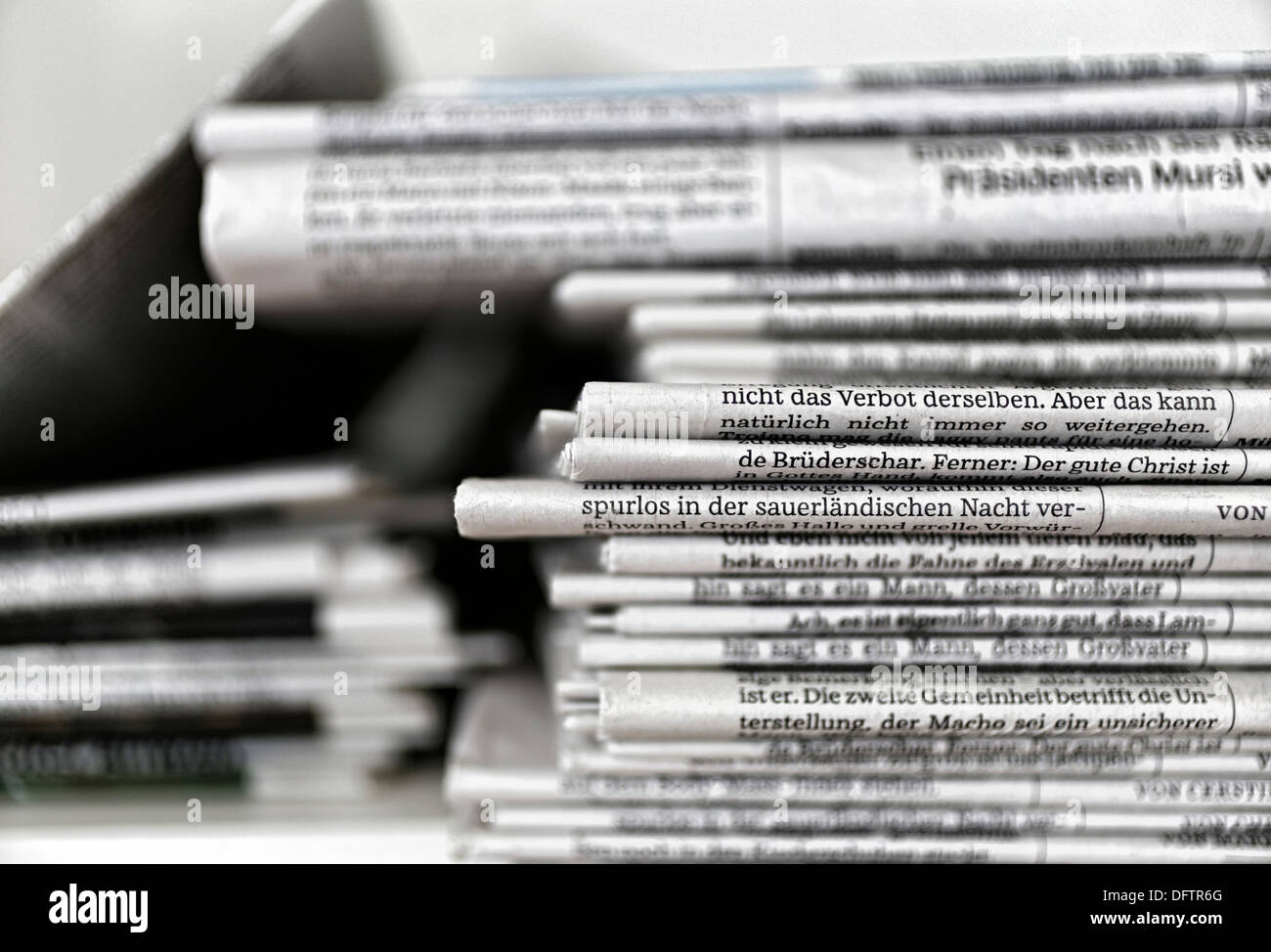 Stack of newspapers, Germany Stock Photo