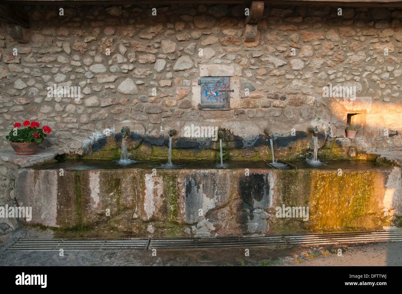 Public fountain from beginnings of the XXth century in a small village of the Cerdanya village in Pyrenees, Spain. Stock Photo