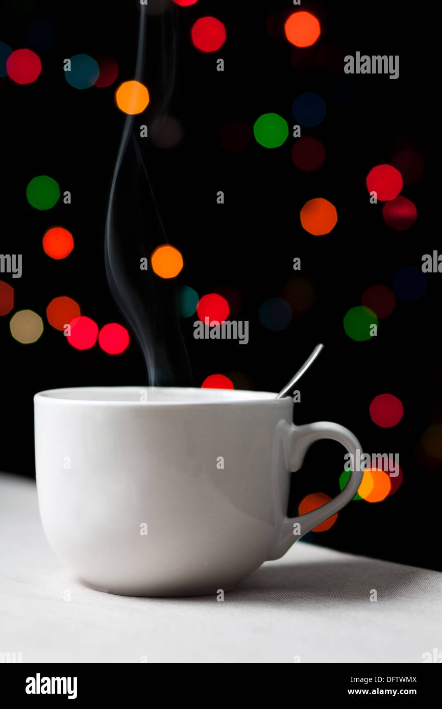 Hot coffee cup on colorful light background Stock Photo