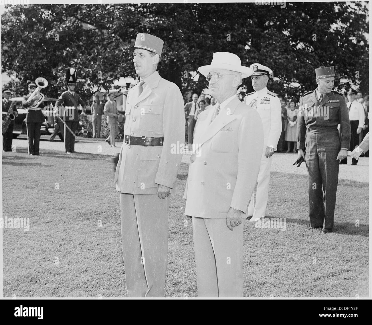 Photograph of President Truman and French President Charles de Gaulle, standing at attention during welcoming... 199187 Stock Photo