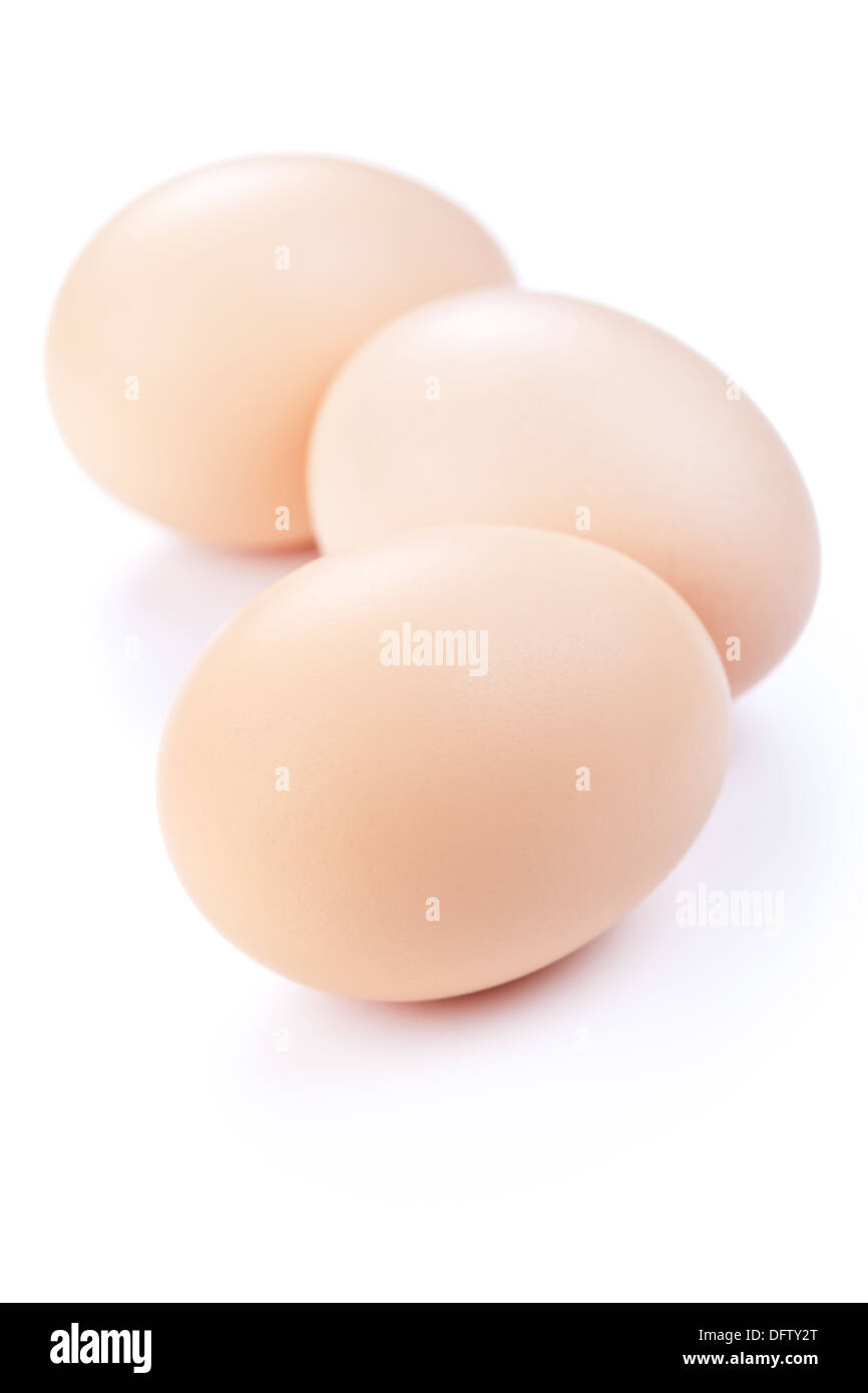 Three eggs on white background. Fresh chicken eggs Stock Photo
