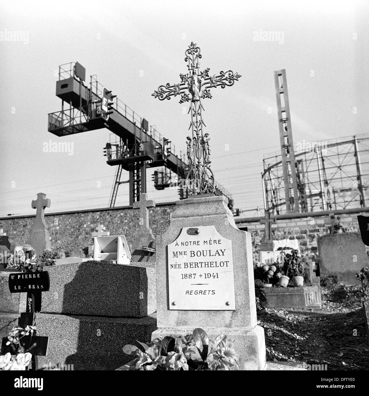 View of a grave on Pere Lachaise, the biggest cemetery in Paris, France, in November 1970. The gravestone commemorates 'Our mother Madame Boulay'. In the background, industrial plants are pictured. On the Pere Lachaise cemetery, many famous historical figures are buried. Photo: Wilfried Glienke Stock Photo