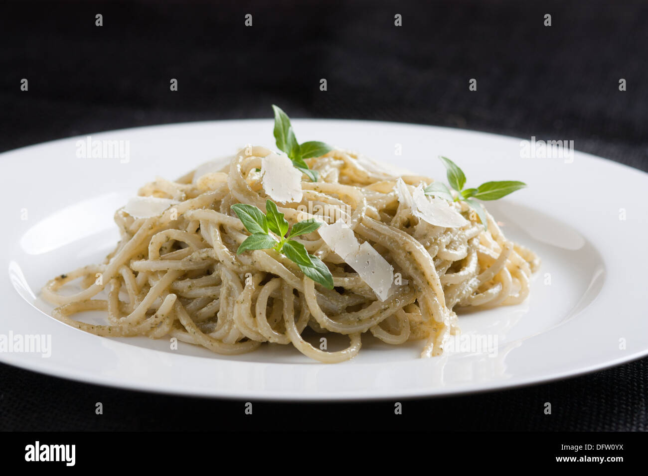 Spaghetti with cheese and basil Stock Photo