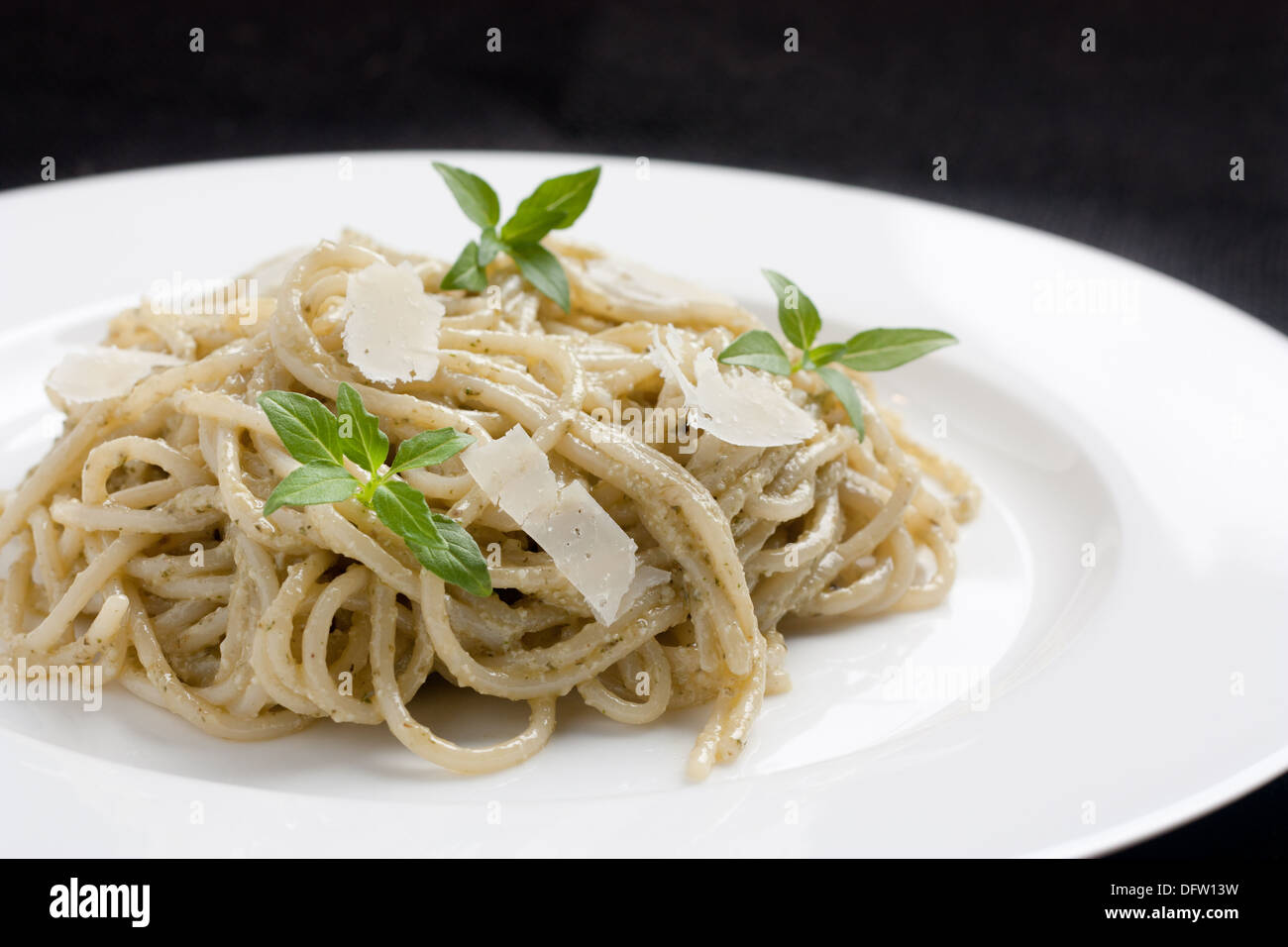 Spaghetti with cheese and basil Stock Photo