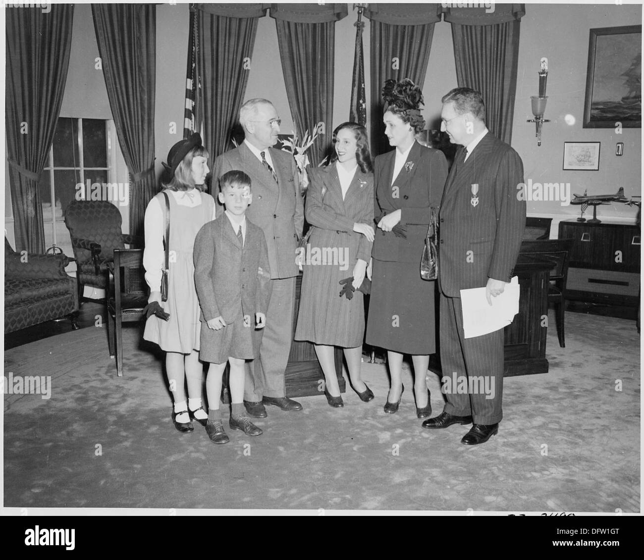 President Truman poses with Undersecretary of the Navy W. John Kennedy and his family in the oval office. Mr. Kennedy... 199635 Stock Photo