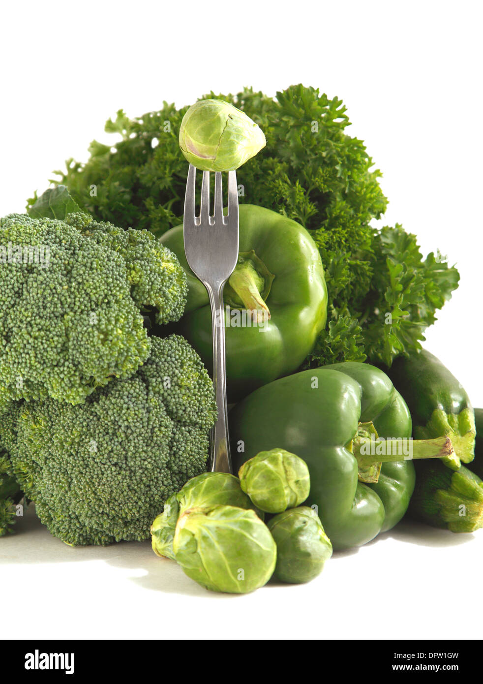 Fresh green vegetables on a white background Stock Photo - Alamy