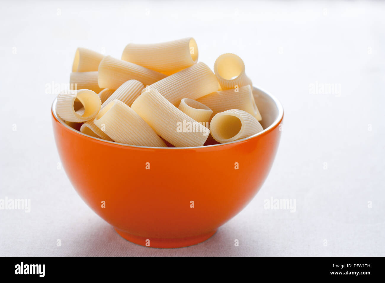 Raw rigatoni in a bowl Stock Photo