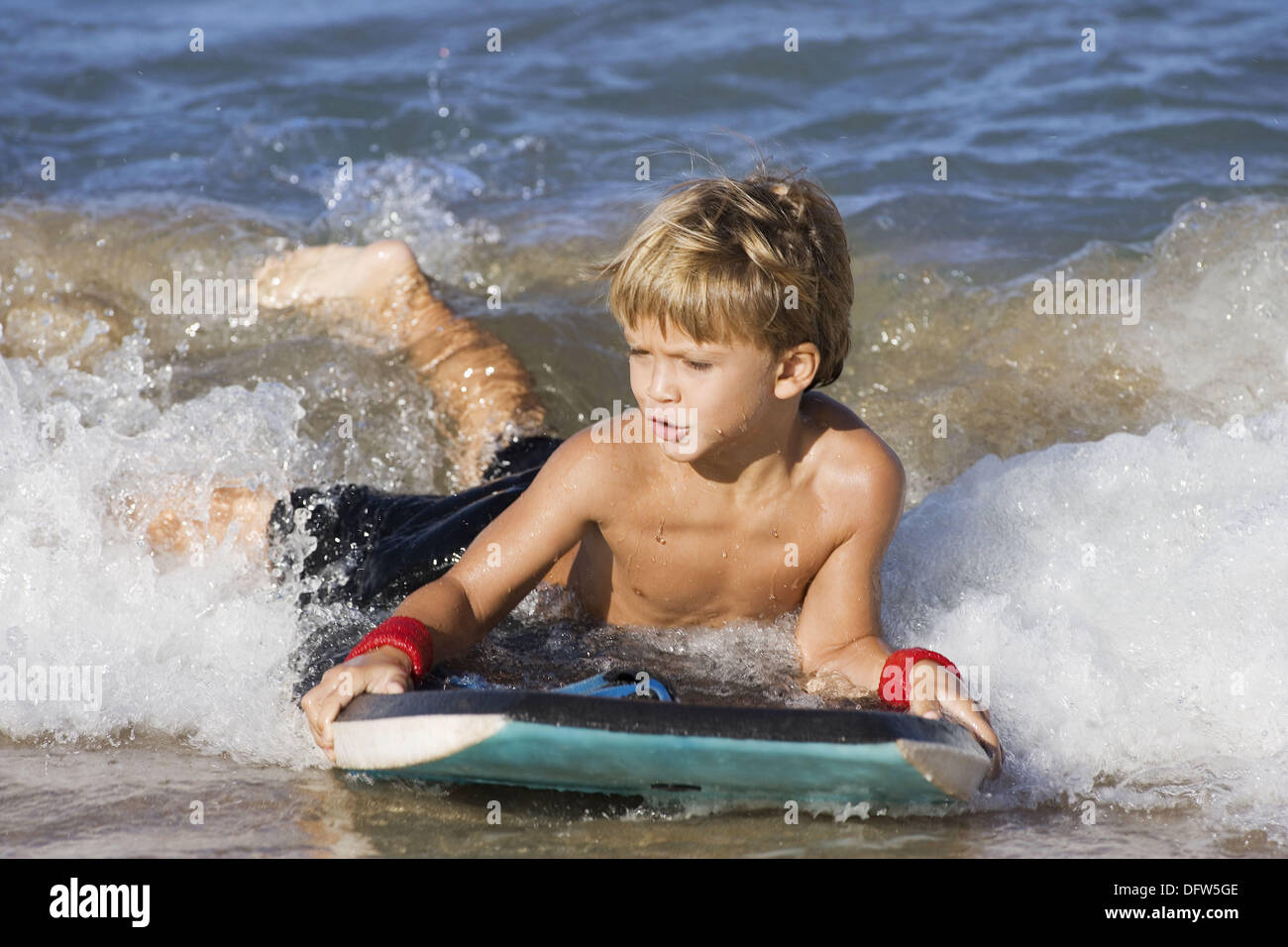 Boy boogie boarding, Maui, Hawaii, USA Stock Photo Alamy