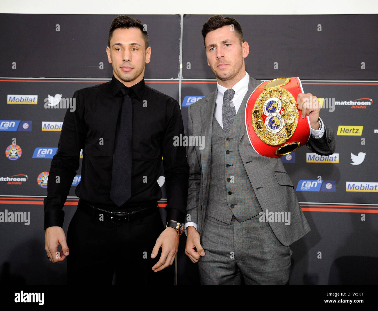 Stuttgart, Germany. 09th Oct, 2013. Challenger Felix Sturm (L) and the IBF middleweight world champion Darren Barker from Great Britain pose during a press conference in Stuttgart, Germany, 09 October 2013. The boxing match for the IBF world championship will take place on 07 December 2013 in Stuttgart. Photo: DANIEL MAURER/dpa/Alamy Live News Stock Photo