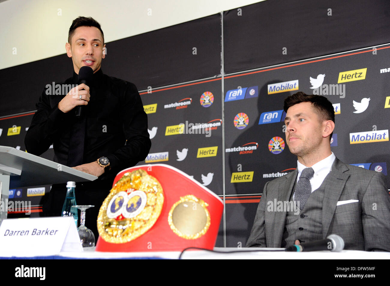 Stuttgart, Germany. 09th Oct, 2013. Challenger Felix Sturm (L) and the IBF middleweight world champion Darren Barker from Great Britain answer questions during a press conference in Stuttgart, Germany, 09 October 2013. The boxing match for the IBF world championship will take place on 07 December 2013 in Stuttgart. Photo: DANIEL MAURER/dpa/Alamy Live News Stock Photo