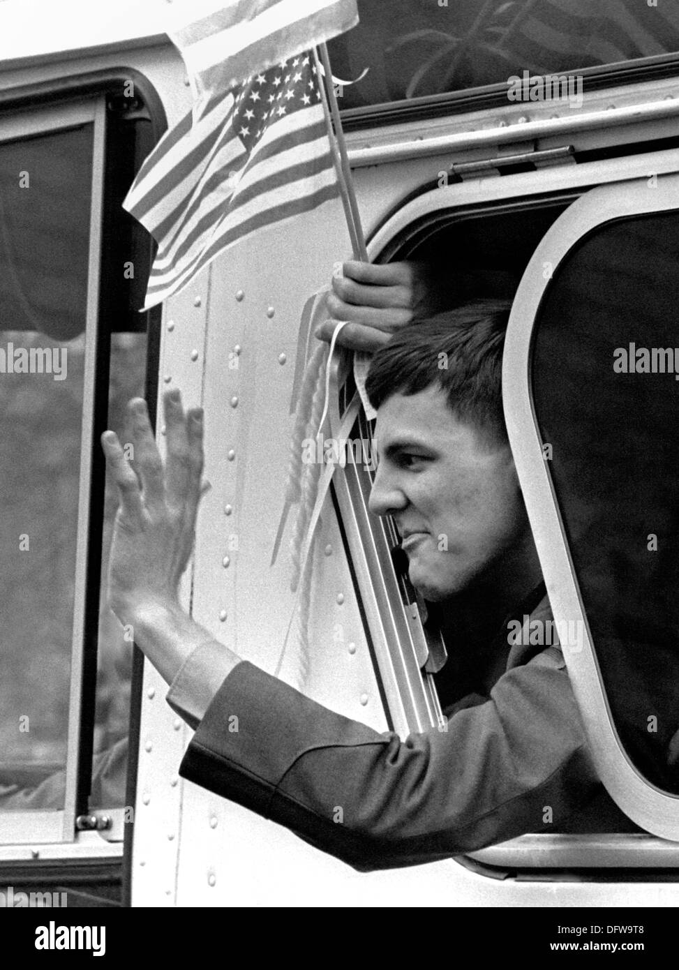 A former American hostage held by Iran waves from a buses during a ...