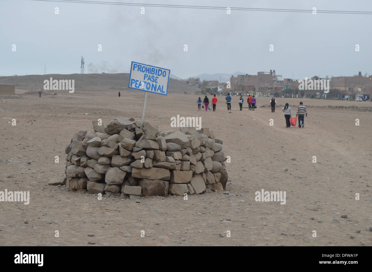 The dusty remains of a pre-Inca 'Huaca' or temple, in the Los Olivos district of Lima, Peru Stock Photo