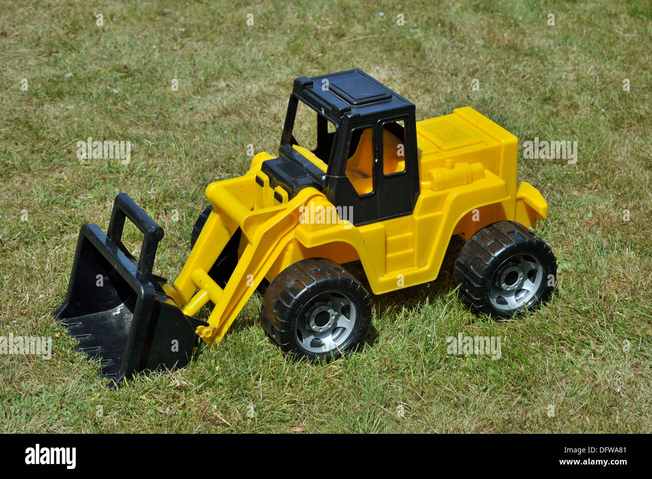 toy plastic yellow tractor Stock Photo Alamy