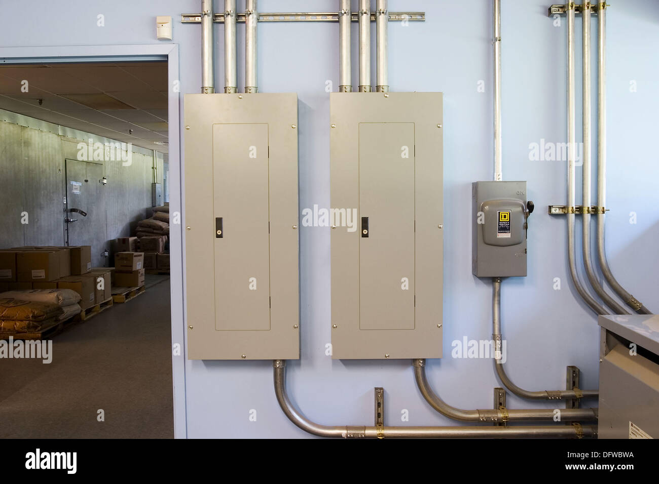 Electrical panels and conduit on a factory wall Stock Photo Alamy