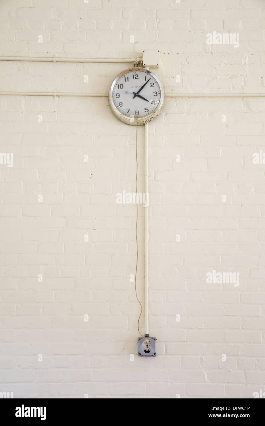 Clock plugged into an electrical outlet Stock Photo Alamy