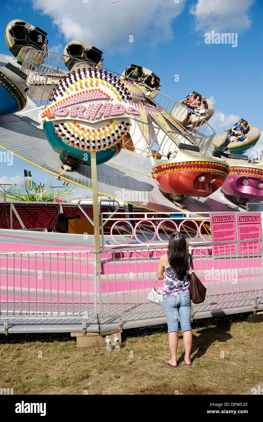 Watching The Rides Mother watching her child on a ride at a fair Stock Photo - Alamy
