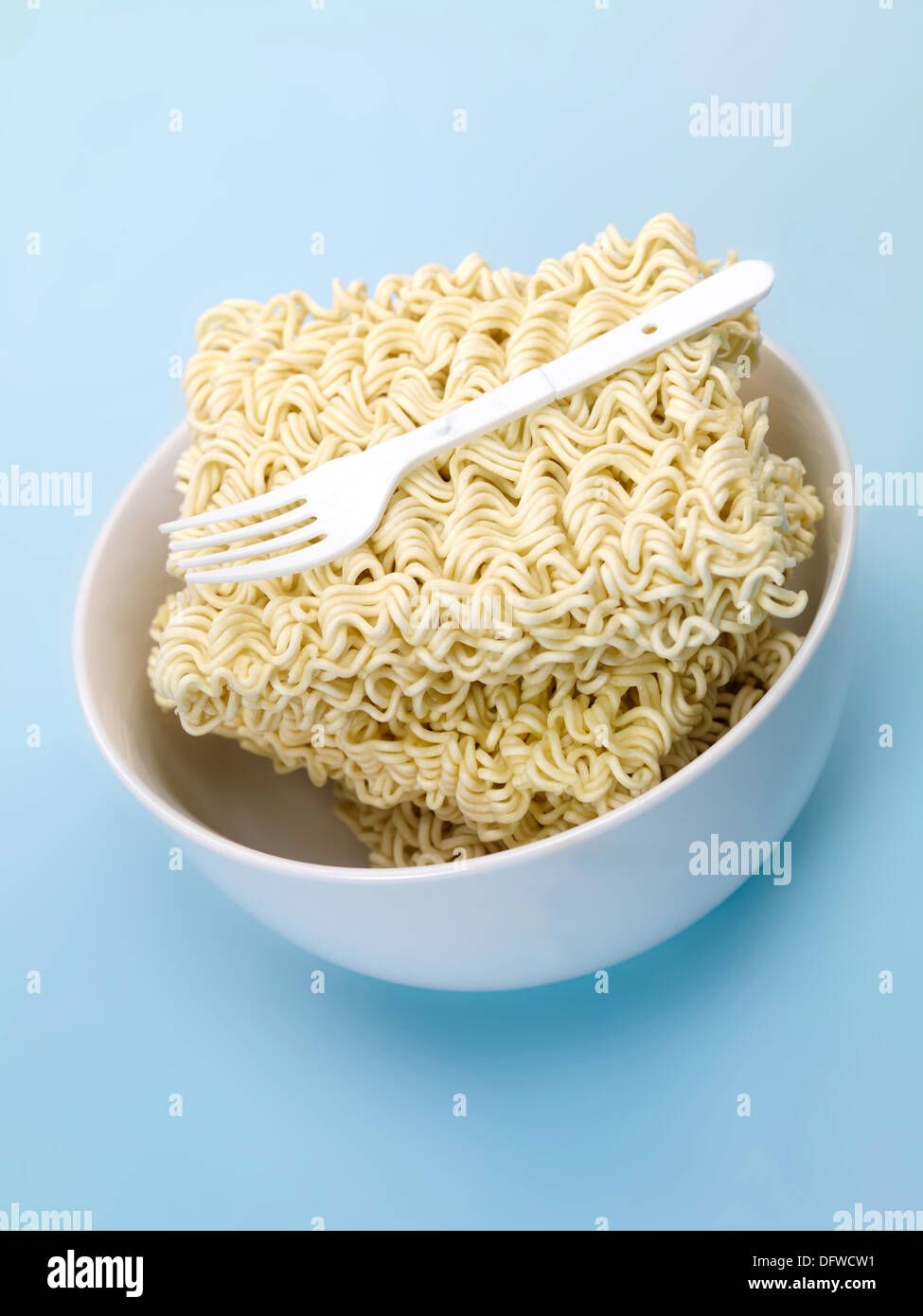 Dry instant noodles isolated against a blue background Stock Photo Alamy
