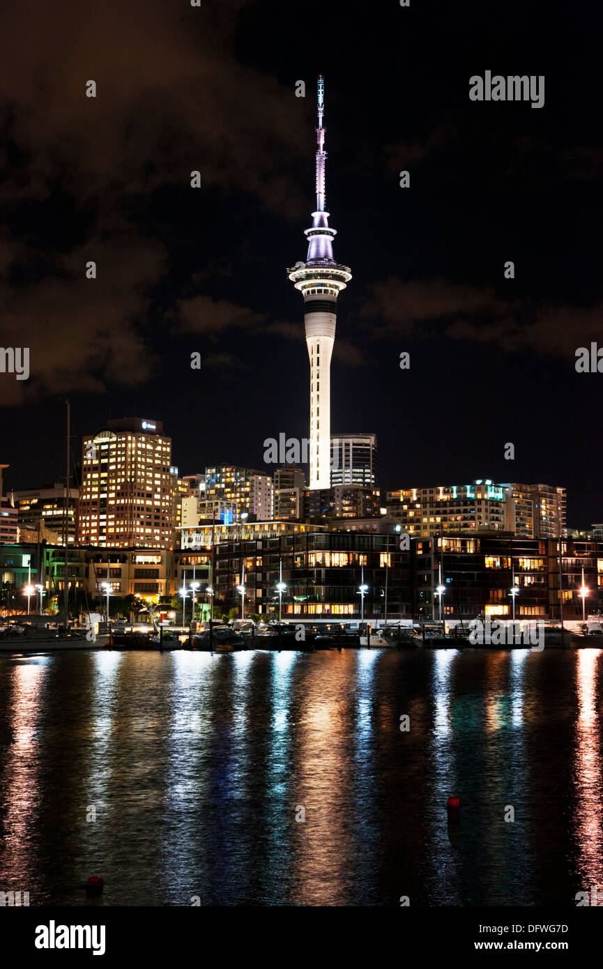 Nightime view of the waterfront and The Sky Tower from Viaduct Harbour, Auckland, North Island, New Zealand. Stock Photo