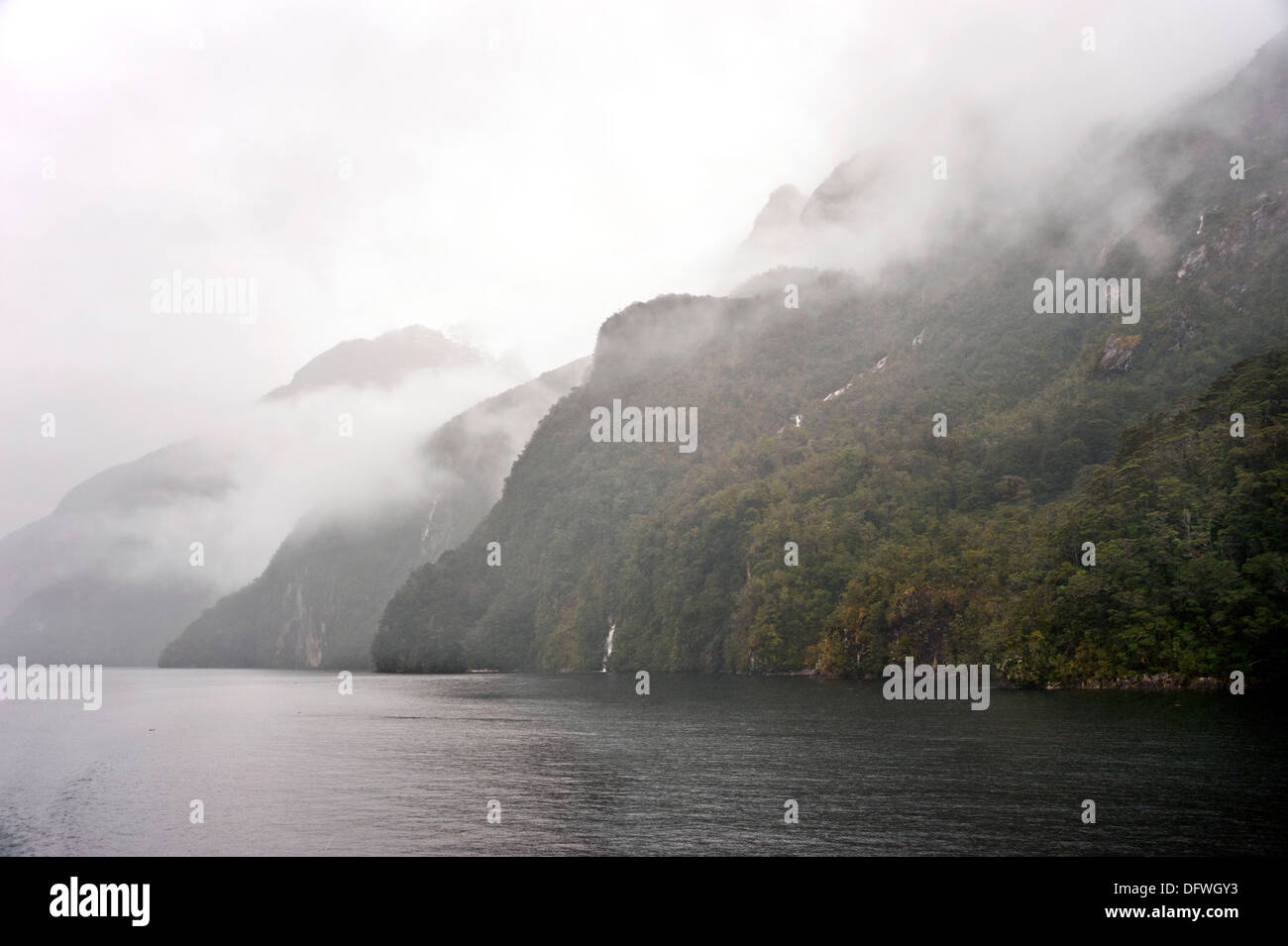 Lake Manapouri in mist and rain, Fiordland National Park, South Island, New Zealand Stock Photo