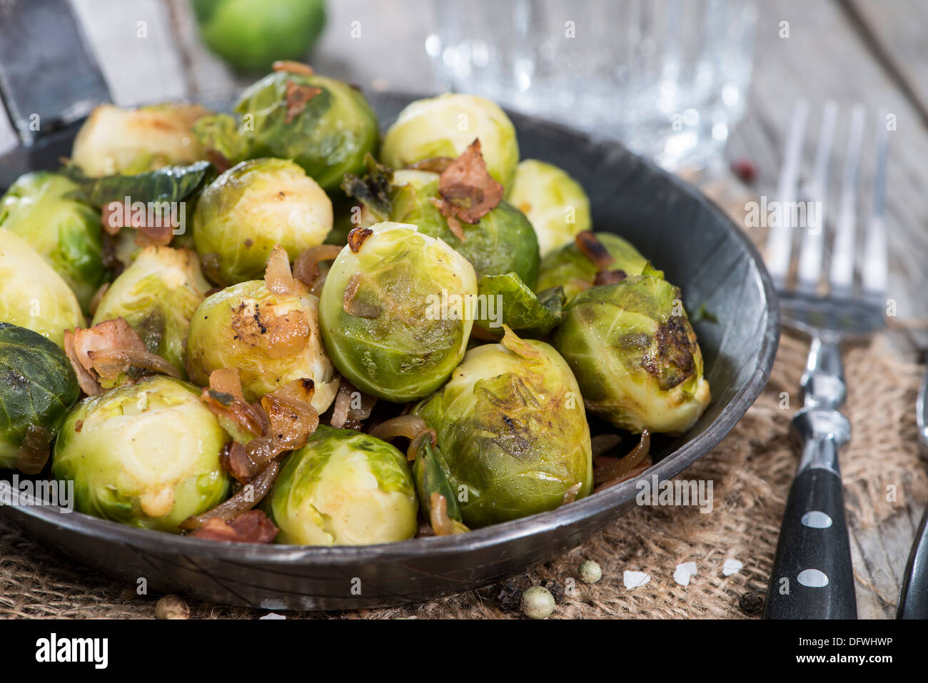 Portion of fried Brussel Sprouts with Ham and Onions Stock Photo