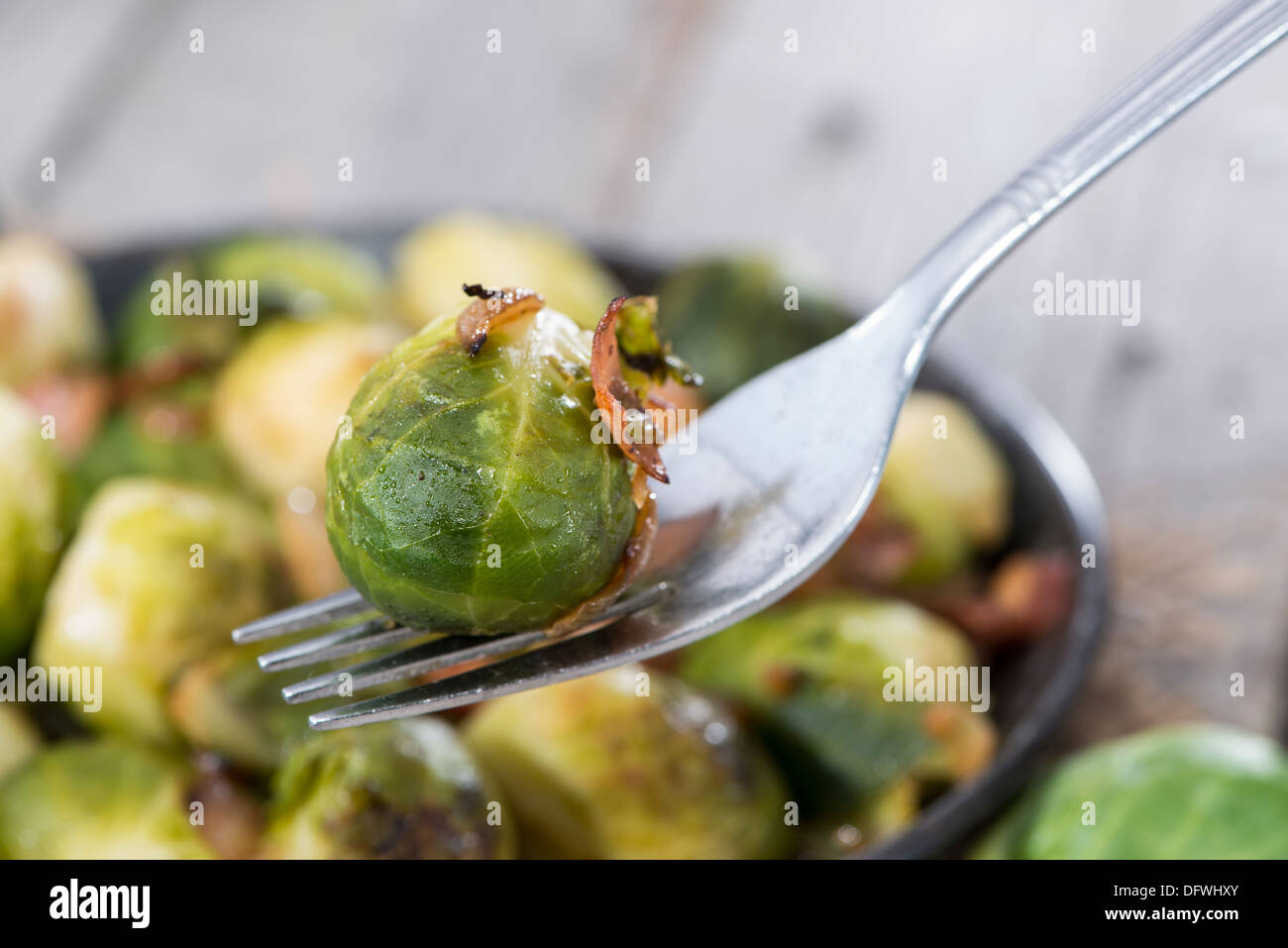 Portion of fried Brussel Sprouts with Ham and Onions Stock Photo
