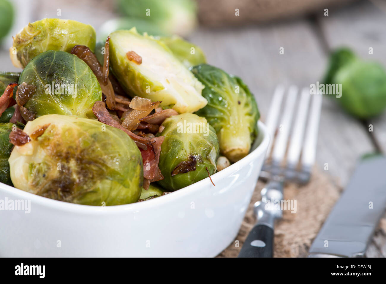 Portion of fried Brussel Sprouts with Ham and Onions Stock Photo