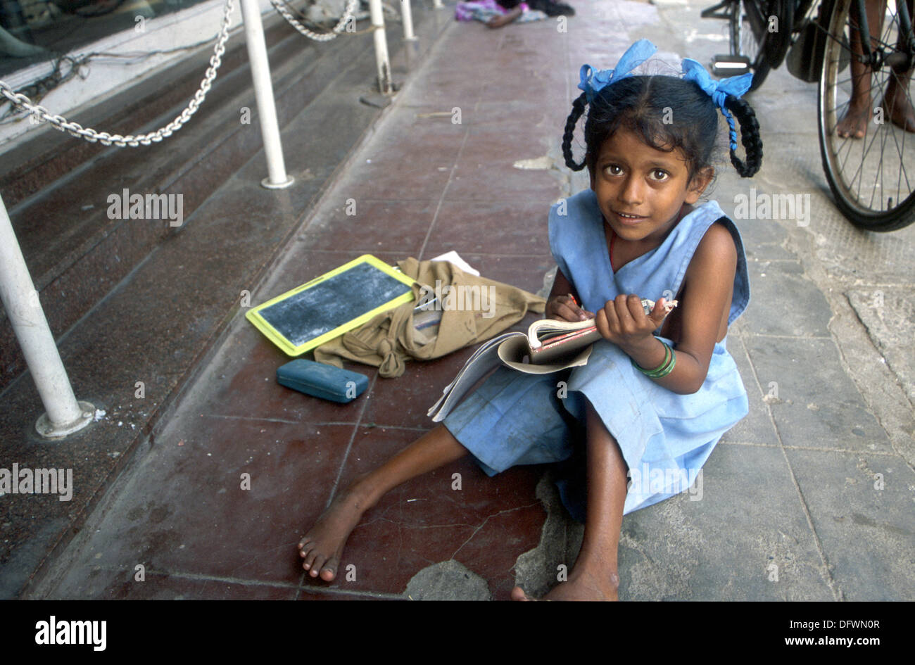 Indian student girls doing her homework in a pondicherry hires stock