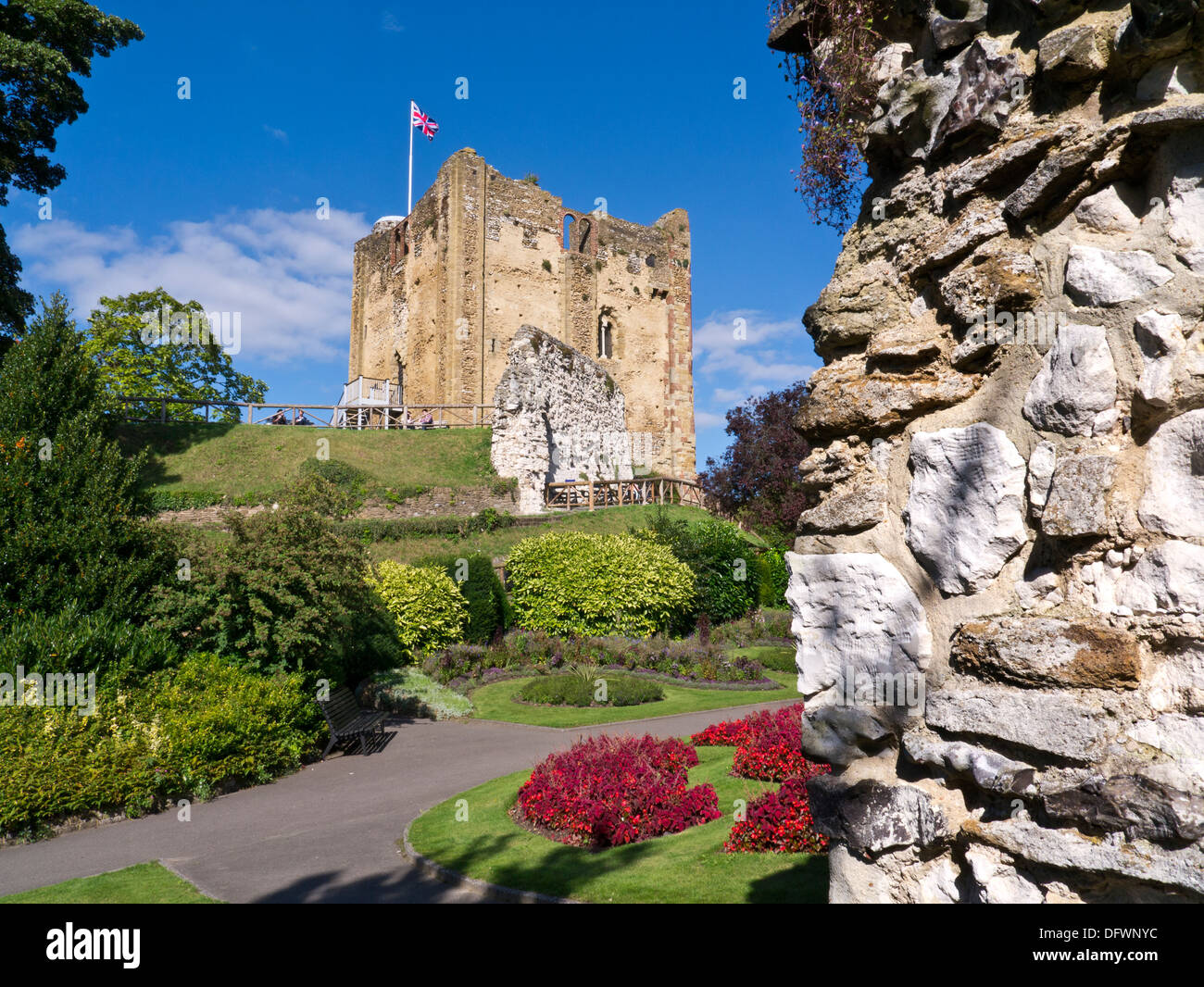 Guildford Castle flying the Union Jack flag with summer floral colour Guildford Surrey UK Stock Photo