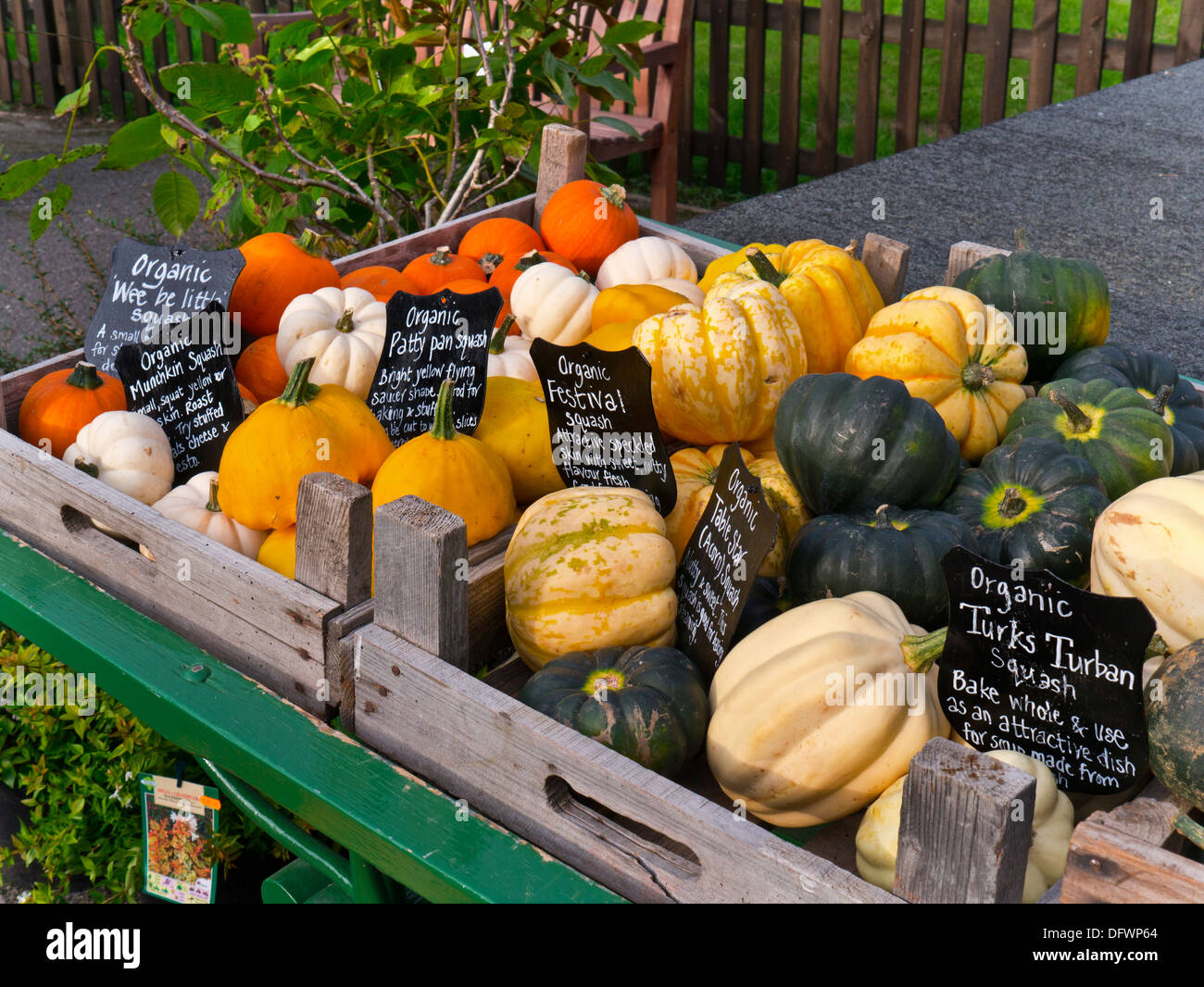 English Squash varieties on display for sale with blackboard prices outside at a typical UK farm