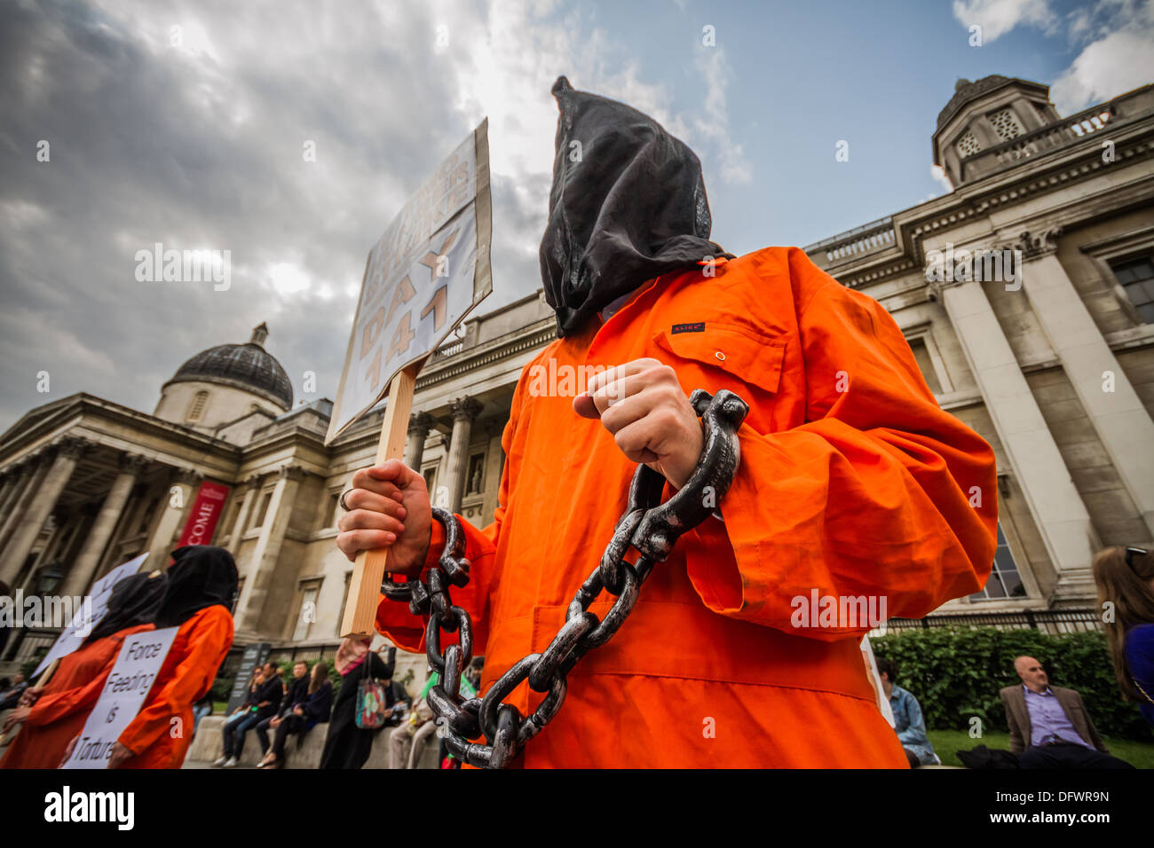 Supporters dressed in Guantanamo Bay detention camp suits attend International Day against Torture in London's Trafalgar Square, UK Stock Photo