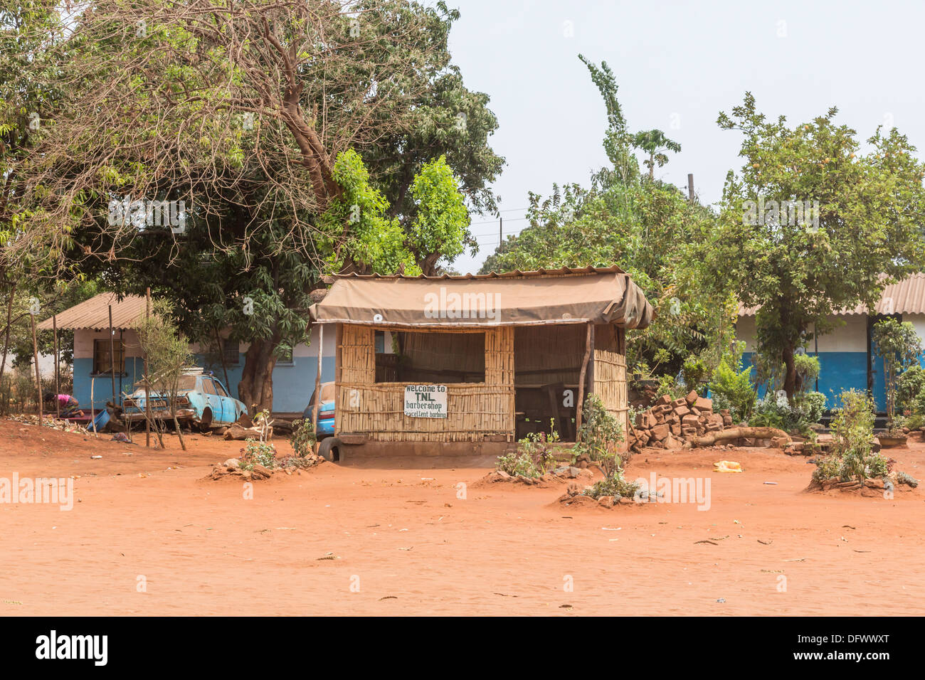 Roadside shack barber shop, with the amusing sign: 'excellent barbing', Livingstone, Zambia Stock Photo