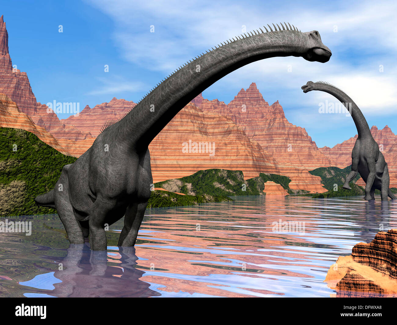 Two Brachiosaurus dinosaurs in water next to red rock mountains on a beautiful day Stock Photo